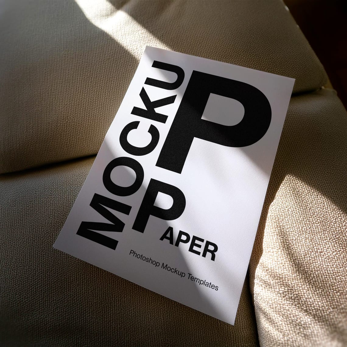 White Paper Mockup On Sofa